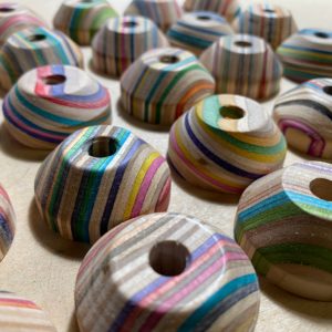 Recycled skateboard 45 record adapter for 7 inch records